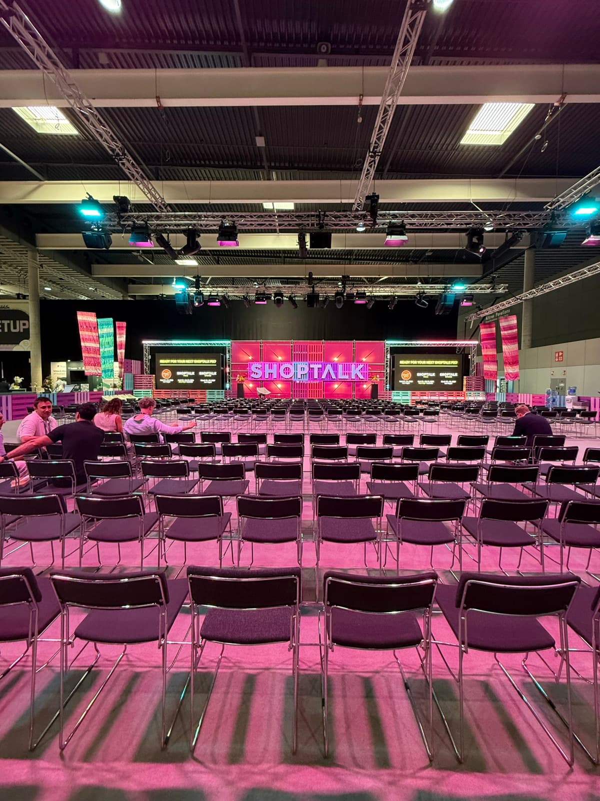 Rows of seats facing the main Shoptalk Europe stage before a keynote session
