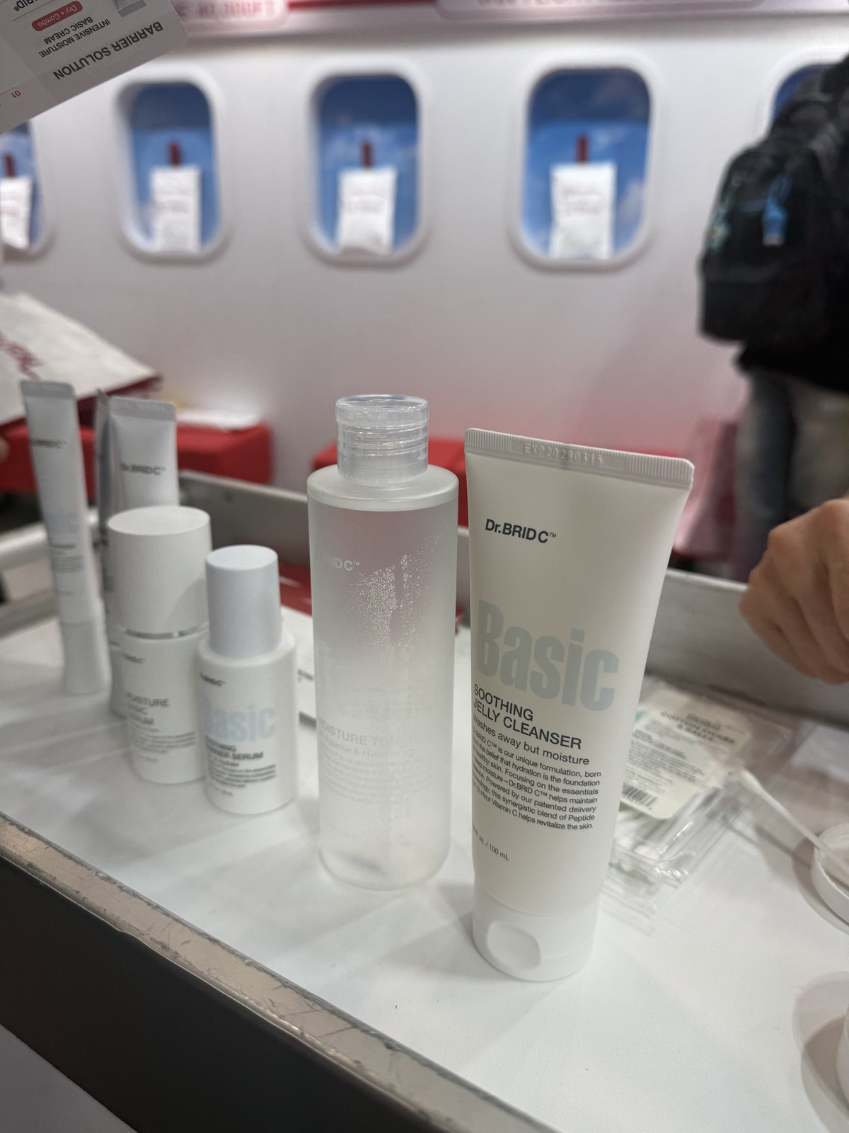 Dr.BRID C skincare products including a jelly cleanser and a moisture toner on the trolley top